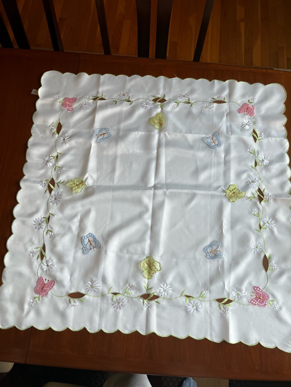 Source Unknown White Embroidered Tablecloth with Pink, Blue, and Green Motifs